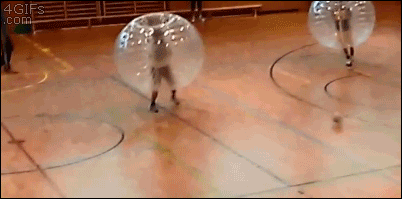 Soccer played with protective plastic bubble