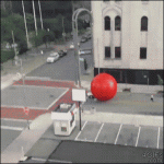 Giant-red-ball-rolls-escapes