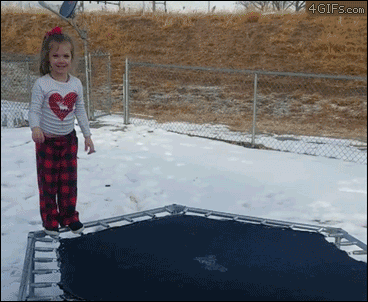Kid-jumps-on-frozen-ice-trampoline