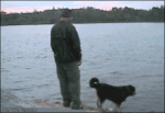 Fisherman-pushes-dog-lake-karma