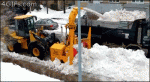 Snow-plow-blower-fills-dump-truck