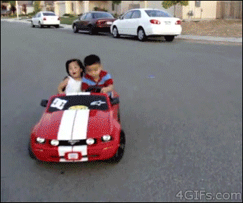 A boy shows off his drifting skills in a Power Wheels