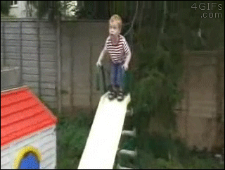A kid jumps onto a slide and falls through it