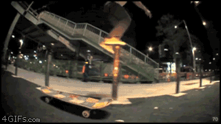 Skater-jumps-bollards-onto-skateboard