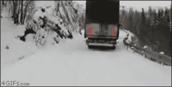 Tow-truck-snowy-road-cliff.gif