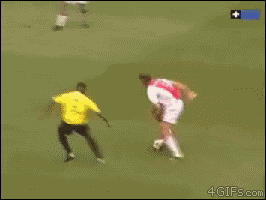 A soccer player trolls with his fancy footwork and scores a goal