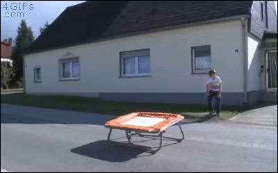 A kid uses a trampoline to jump on a moving car and causes an accident