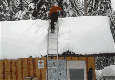 Guy shoveling snow falls off the roof, flips and lands on his feet like a boss