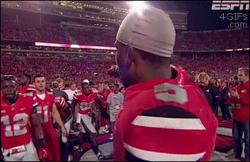 Football player is denied his turn for a hug from a teammate
