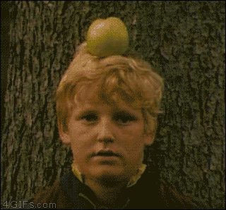 An archer plays target practice with an apple on top of a kid's head