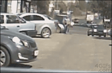 A woman drives head-on into a stationary car in front of her without slowing down