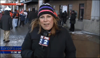 A guy trying to videobomb a news reporter ends up slipping and falling on the ice