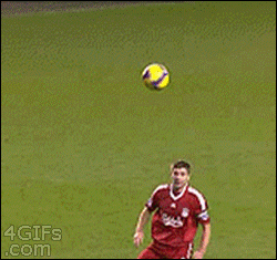 A player whiffs when he attempts to kick a soccer ball and falls down in pain and shame