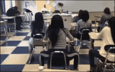 Students sitting in a classroom sneak in a twerking session