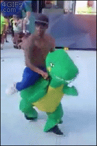 A guy dances in a costume that looks like he's mounted on a dinosaur