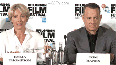Tom Hanks slyly sneaks an iPad into his jacket during an interview