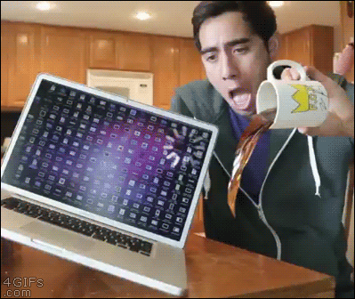 A troll makes it look like coffee is about to spill on his computer
