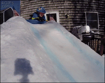 A father set up a backyard luge track in the snow for his son