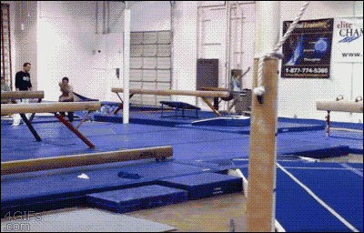A guy performs a quadruple kong vault parkour move