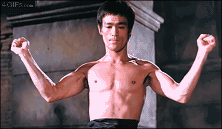 Bruce Lee flexes his lats