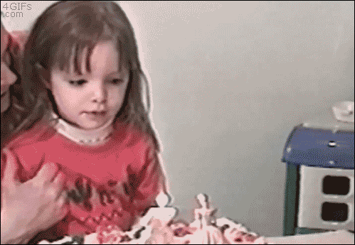 A girl is just about to blow out her birthday candles when her brother does