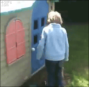 A kid knocks on a playhouse then gets hit by the door
