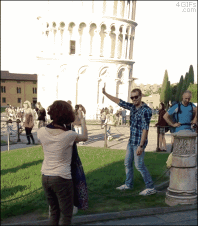 A man uses a judo throw on a tourist doing a classic pose for the Leaning Tower of Pisa