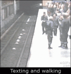 Train-tracks-walking-texting