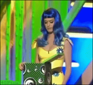 Katy Perry gets a surprise when she looks into a box