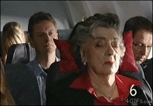A jerk on an airplane steals a woman's pillow