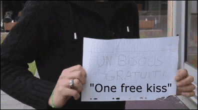A guy holding a "one free kiss" sign doesn't go over well