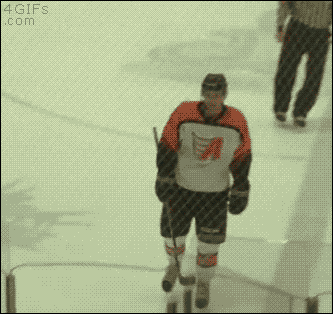 A hockey player clotheslines himself with his stick