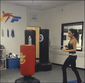 A woman kicks a water bottle with power and accuracy