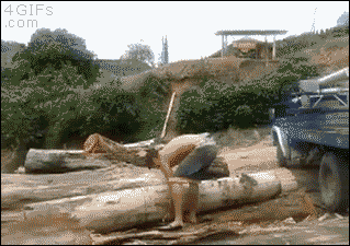 A troll lifts a huge tree trunk log
