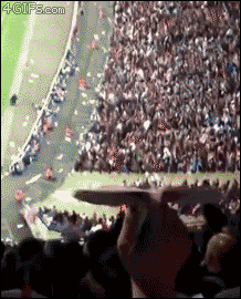 A paper plane thrown from the stands hits a soccer player in the head