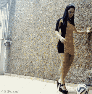 A woman juggles a soccer ball with high heels on