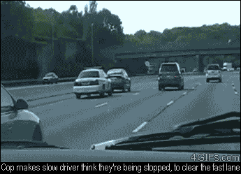 A cop makes a slow driver think they're being pulled over, to clear the fast lane