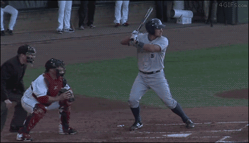 A catcher throws a baseball right into the side of the batter