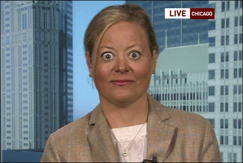A woman's eyes are wide open during a TV interview
