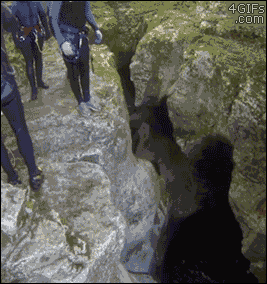 A guy hiking slips off a ledge and falls into water below