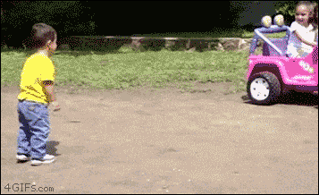 A girl has no mercy for her brother while riding a Power Wheels