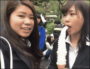 An oversized ice cream cone falls into a girl's hair