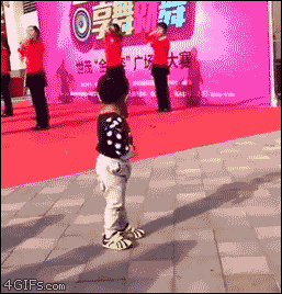 A toddler upstages a group of dancers