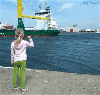 A girl asks a ship to blow it's horn and then gets scared by it