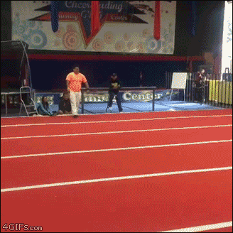 A portly fellow performs gymnastics flips for a crowd