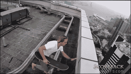 An adrenaline junkie skateboards on roof ledge
