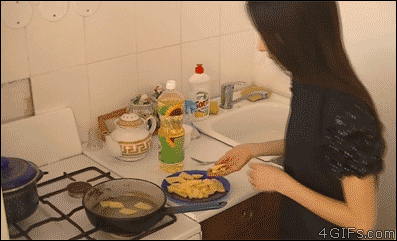 A girl starts a large fire in the kitchen