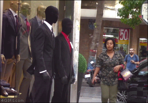 A man pretends to be a mannequin