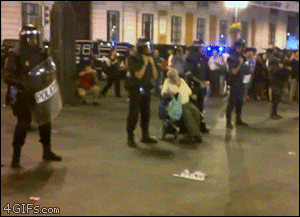 Wheelchair-protester-taunts-riot-cops
